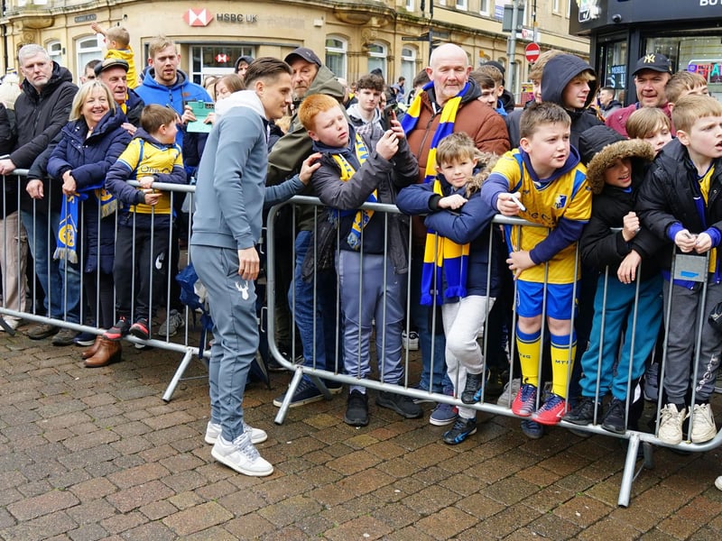 Crowds packed into Mansfield town centre this afternoon to salute their heroes.