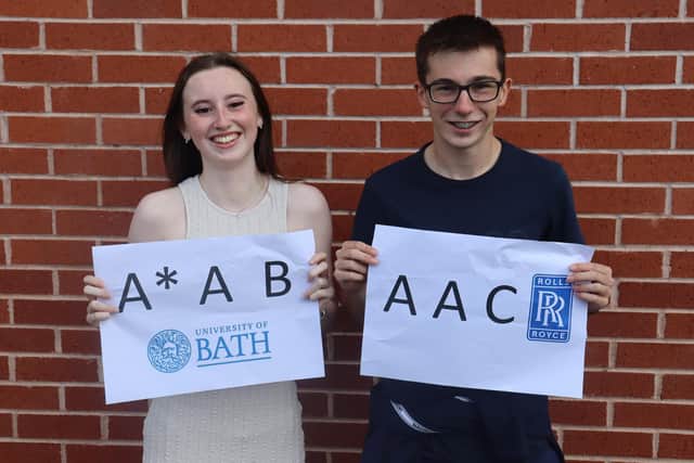 Freya Meakin and Fynnlay Bardgett showing off their amazing A Level grades at Hall Park Academy.