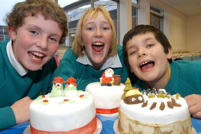 Winners of the Braken Hill School Cake competition get ready to eat their prize winning cakes in Kirkby. From the left are Kim Higginson 1st prize, Elizabeth Atkinson 2nd prize and Michael Riley 3rd prize. Asda at Sutton provided the ingredients and a prize for the winner. 2007.