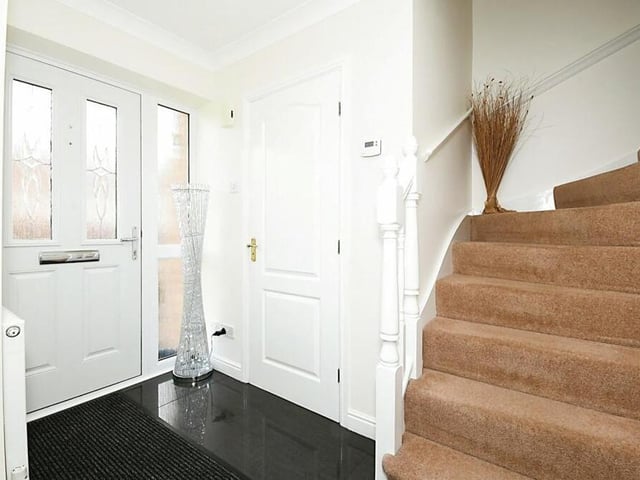 Step through the front door to be greeted by this inviting entrance hall at the Fonton Hall Drive property.
