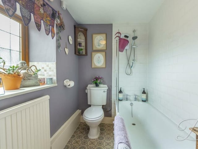 Completing our first-floor tour is the family bathroom, which includes a panelled bath, low-flush WC and wash hand basin. The window faces the front of the house.