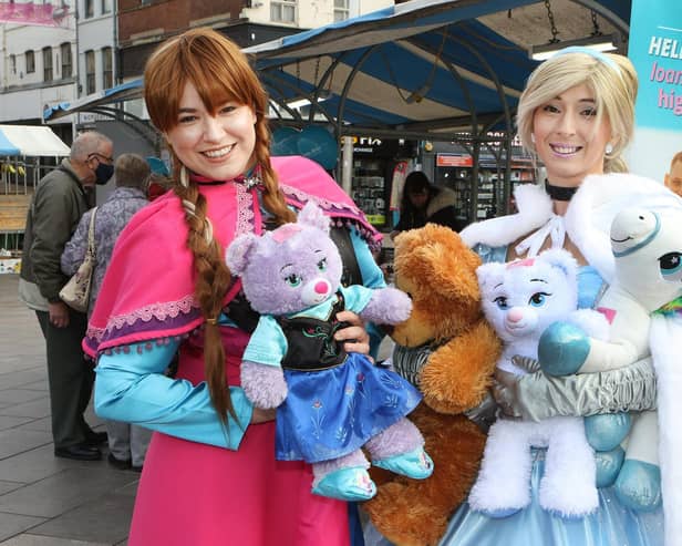 Party princesses Anna and Cinderella show off some of the teddy bears and soft toys on the credit union stall, which raised money for Mansfield Soup Kitchen.