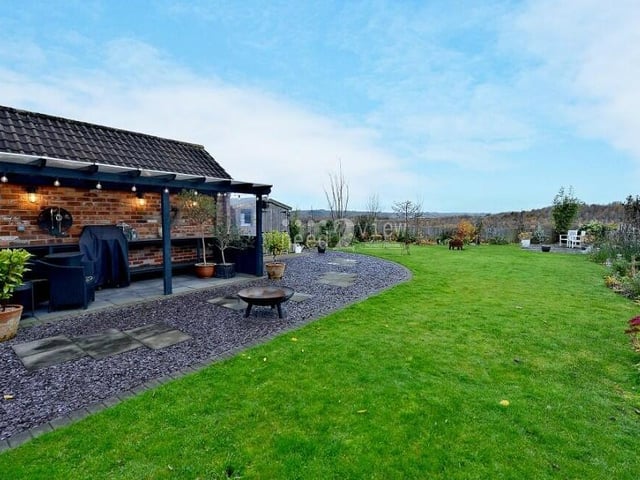 Let's step outside now, and here is our first look at the beautiful rear garden.
