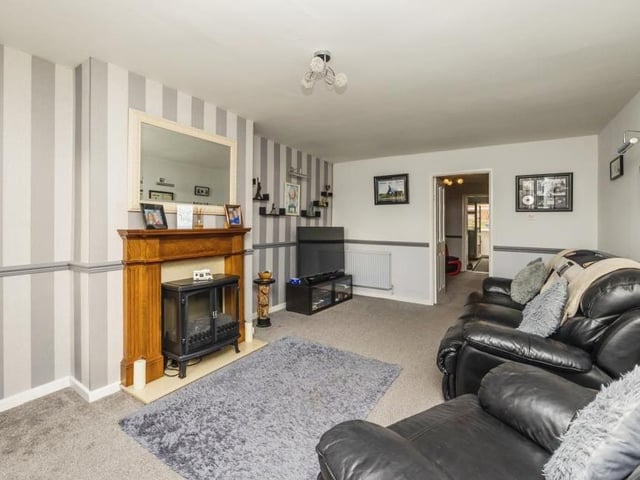 Our photo gallery of the Kimberley property begins in the spacious lounge, complete with a lovely fireplace that adds lots of character to the room.