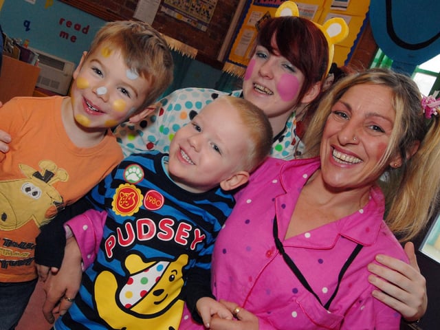Diamond Avenue crèche members Robbie Lakin and Jamie Taylor sport their face paint and fancy dress with staff Emma Hayes and crèche leader Tracey Clarke for a fundraising day for Children in Need. 2010.