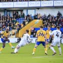 Hiram Boateng shoots during Saturday's defeat against Crawley Town FC at the One Call Stadium, 06 April 2024, Photo credit Chris & Jeanette Holloway / The Bigger Picture.media