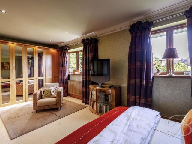 This second shot of the master bedroom at the Huthwaite bungalow unveils a sizeable, built-in wardrobe, not to mention comfortable living space.