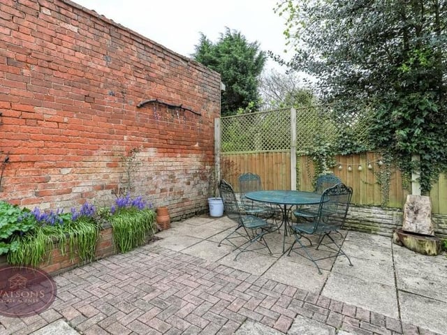 Here is one of the pleasant seating areas on the patio of the garden, where you can entertain friends or just sit back and relax.