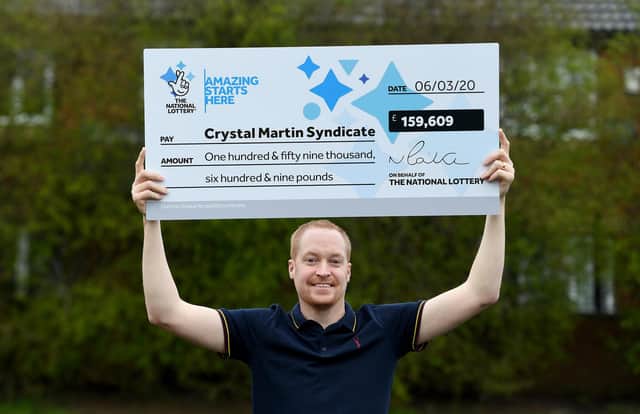 Craig Rowland with the EuroMillions winning cheque. Photo: Sam Bagnall
