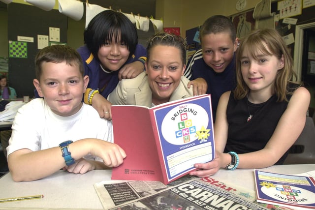 Pupils from year 6 at Anns Grove Primary School using the Star's Bridging Blocks maths books. They are, left to right, all aged 11, Daniel Lawless, Jenny Sam, teacher Karen Allott, Luke Ebanksand Katie Ward.