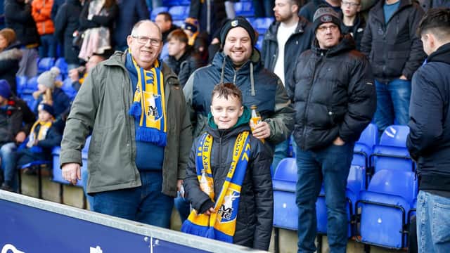Mansfield Town fans enjoy the win at Stockport County