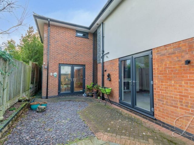 Another section of the exterior, which is accessed via a pair of French doors leading from the lounge and the dining room.