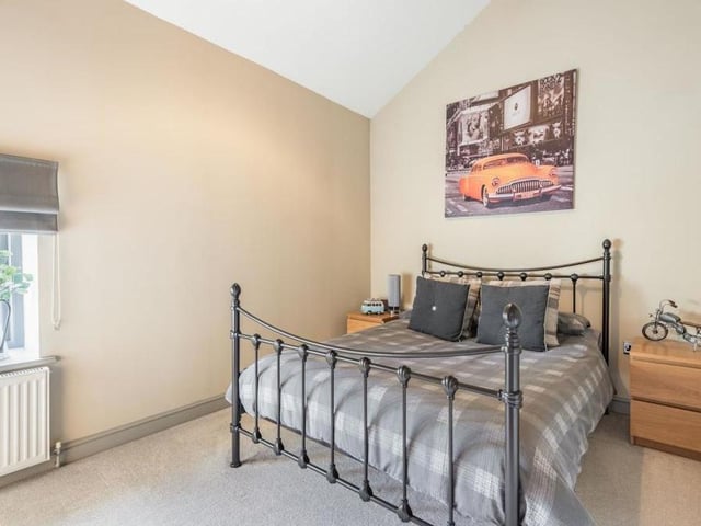 The third double bedroom, which faces the front of the Mansfield property, is also full of character and includes a feature ceiling truss.