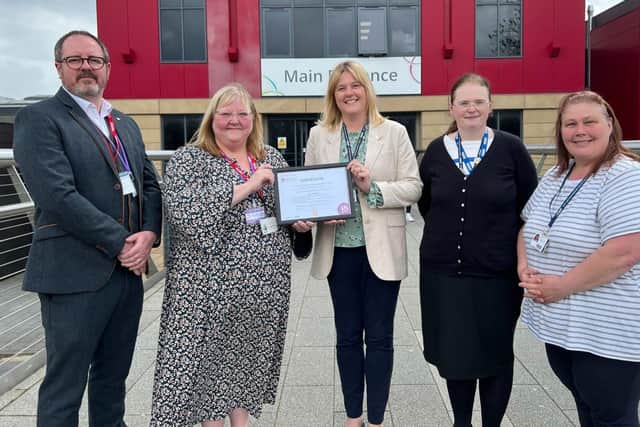 Jayne Davies, second left, presents the Carer-Friendly Employer Quality Mark certificate to Sian Geeson, centre, joined by Matthew Bird, team-leader at NCA, and carers’ champions Jane Hawksford, second right, and Teresa Harvey.