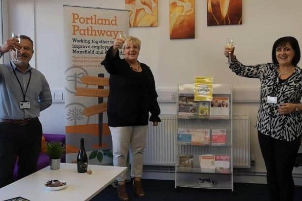 Staff at Portland Pathways raise a glass to their success.