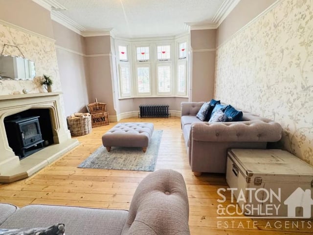 Towards the front of the property you'll find a stunning lounge with a bay front window allowing through plenty of natural light, along with a log burner