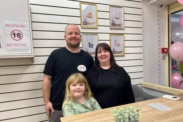 Katy Bacon, Dave Foulstone and their daughter Freyja behind the counter on opening day in Feb 2023.