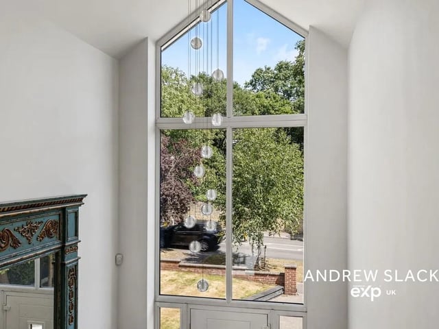 Step through the designer entrance hall with its feature glazing and statement chandelier, opening onto beautifully finished interiors.