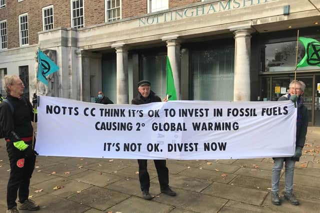 Protestors outside a Nottinghamshire pensions meeting, urging Nottinghamshire Council to divest from fossil fuels.