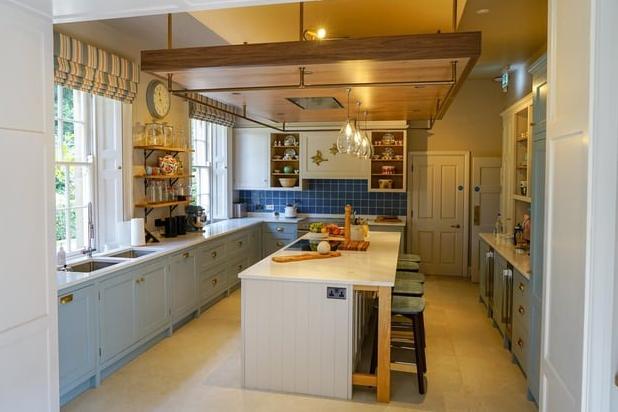 The kitchen is now the heart of the home, stocked with four ovens, countless fridges and umpteen shelves heaving with Royal Doulton China, poised for a feast.