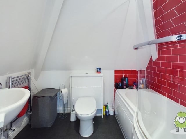 The second-floor bedroom also has access to this en suite bathroom.
