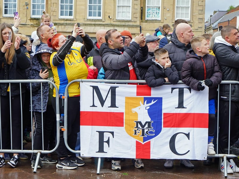 Crowds packed into Mansfield town centre this afternoon to salute their heroes.