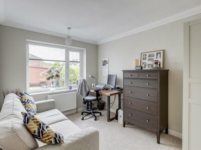 The second bedroom at the Kirkby bungalow is also a good size, and can be converted into a home office, if required. Facing the rear of the property, it has a carpeted floor.