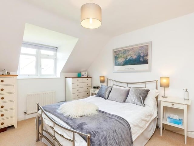 The second bedroom is cosy and well presented. With a carpeted floor, its uPVC double-glazed window faces the front of the house.