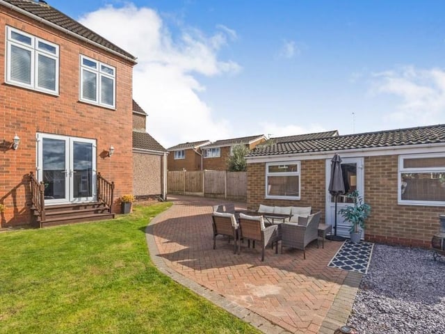 The last photo in our School Hill gallery shows the pleasant patio area in the garden, sandwiched by the lawn and the garage.