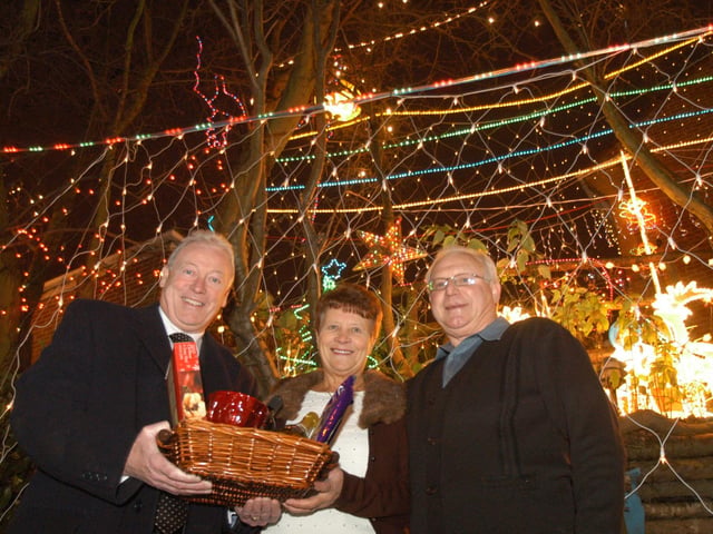 In 2007, Tony Egginton, left, Mansfield Executive Mayor, presented a Christmas Hamper for the best Christmas Lights in the District to Ellen and Brian Caldwell of Mansfield Woodhouse.