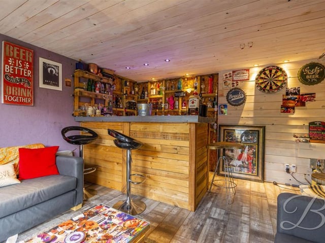 The summer house has been turned into a garden bar.