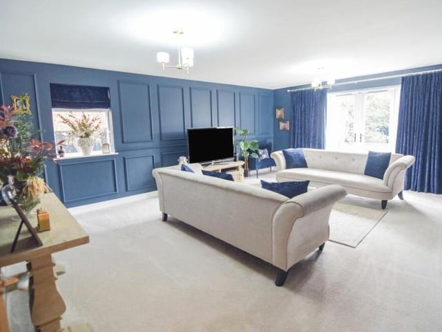 The main reception room at the Hawksworth Avenue house is this large and bright lounge. Door lead out to the garden.