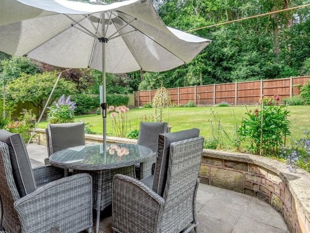A close-up of one of two pleasant seating areas in the garden of the £720,000 property.