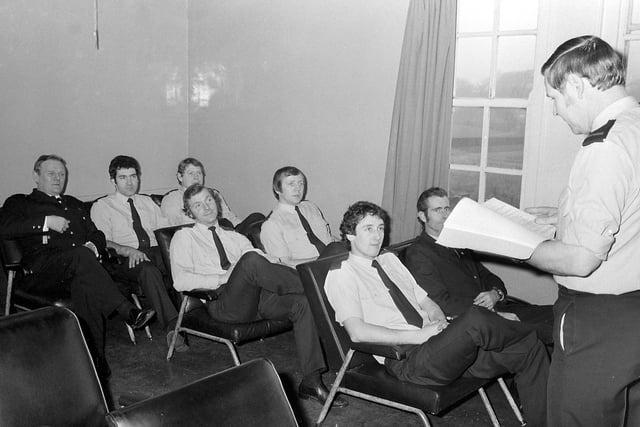Mansfield firefighters pictured in a meeting in 1980.