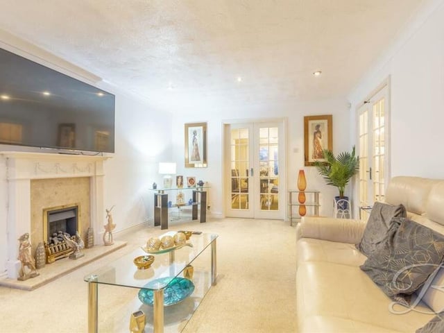 We begin our tour of the Granby Avenue home in the charming lounge, which has a lovely feature fireplace. Double doors lead into the dining room.