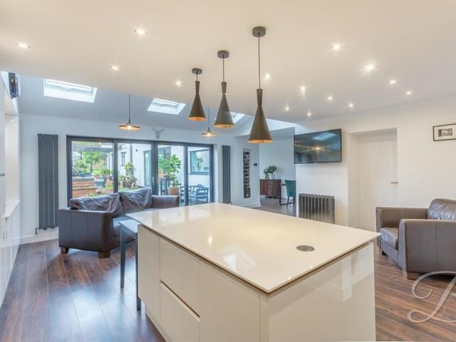 A final shot of the kitchen, which is perfect for cooking meals for guests. Downlights and three skylights add to the brightness of the room.