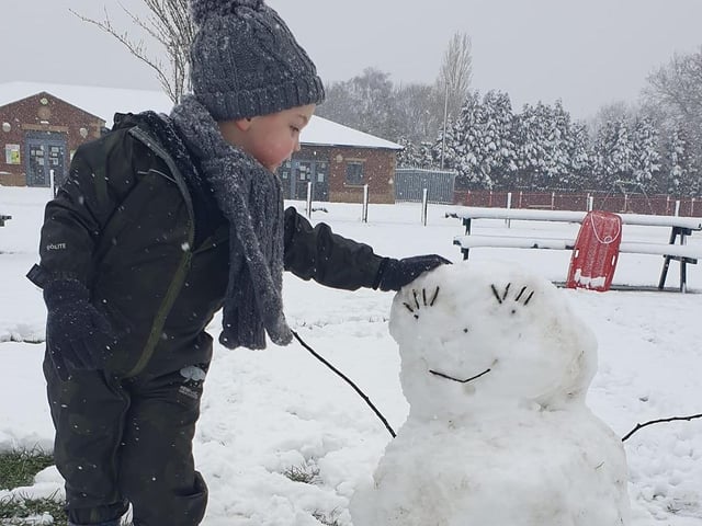 Building a snowman on Sutton Lawn.