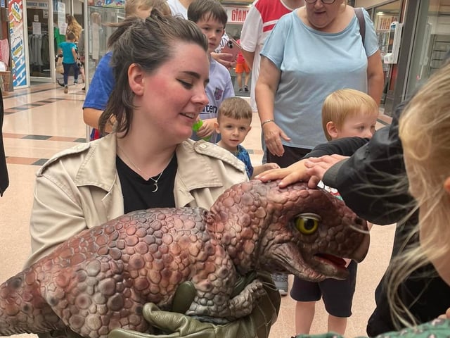 A Jurassic visitor enjoys some attention.