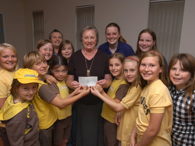 In 2009 Audrey Wardman, centre, who is the past president of the Inner wheel club of Bolsover, presents a £300 cheque to brownies from the 1st Pleasley and New Houghton group. The money comes from various fund raising activities throughout Mrs Wardman's term of office and will be put towards a camp holiday.