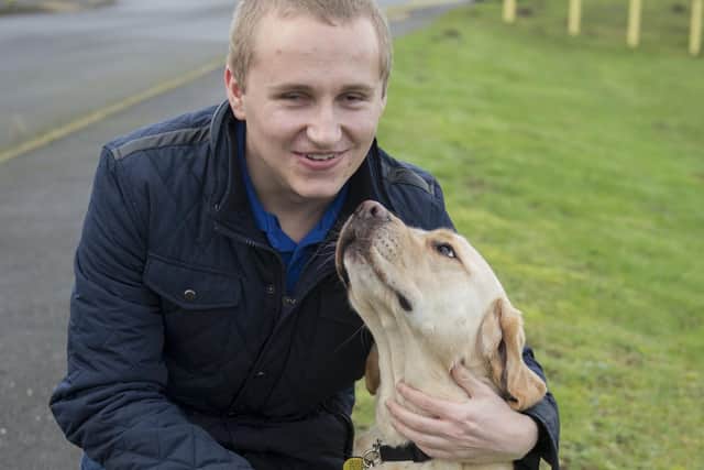 A well-known beneficiary of the Chad's long-standing appeal, Mansfield man Nathan Edge, with his loving first guide dog, Hudson.