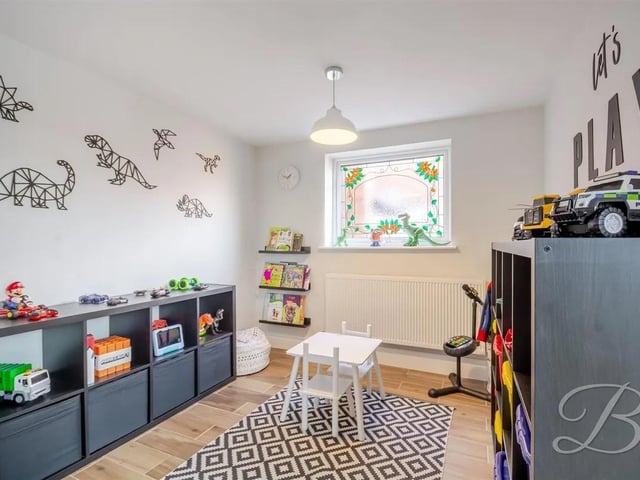 A convenient study or playroom offers flexibility for work or leisure.
