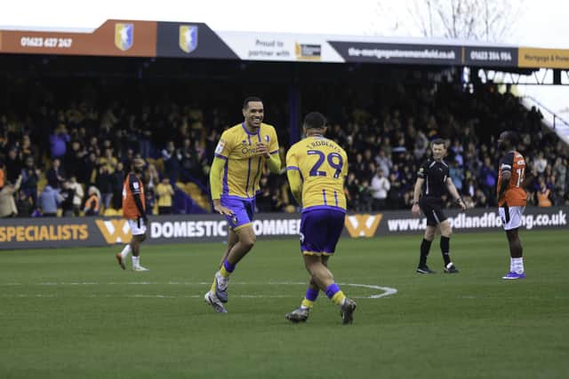 Mansfield Town midfielder Jon Russell celebrates his opening goal with Tyler Roberts during the Sky Bet League 1 match against Luton Town FC at the One Call Stadium, 18 Apr 2026, Photo credit Chris & Jeanette Holloway / The Bigger Picture.media