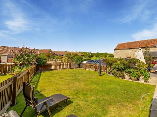 The front garden at the Sookholme property includes this pleasant and well-maintained lawn.