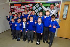 Headteacher Craig Robertson celebrates Dalestorth Primary School's good Ofsted report with some proud pupils.