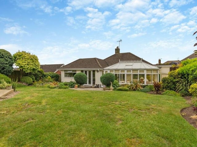 This shot shows the back of the £450,000 bungalow, with the conservatory to the right and the French doors from the dining area to the left.