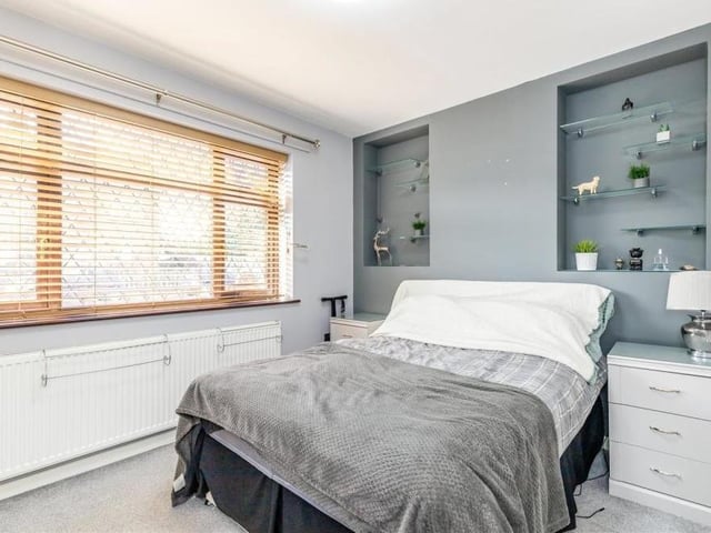 The bedroom in the annexe of the £375,000 property is smart. It has fitted wardrobes with hanging rails, while the window faces the front of the house.