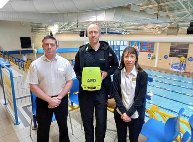 Mark Welch, Carl Smith and Carolyn Hallam pictured with the defibrillator at Water Meadows