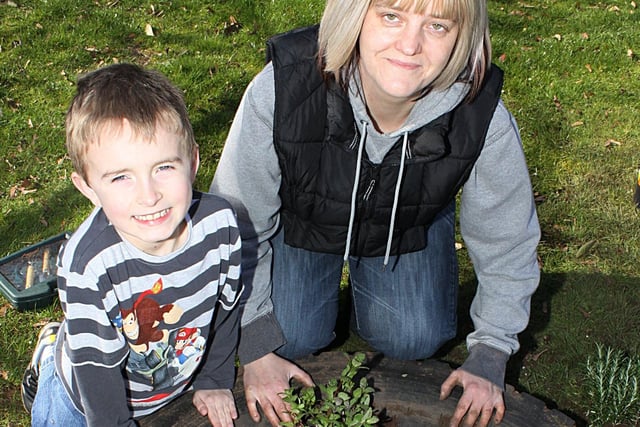 2010: Admiring the new garden at Larkfields Infants School are Sam Bowmer, seven, and Spar shop supervisor Debbie Bird.