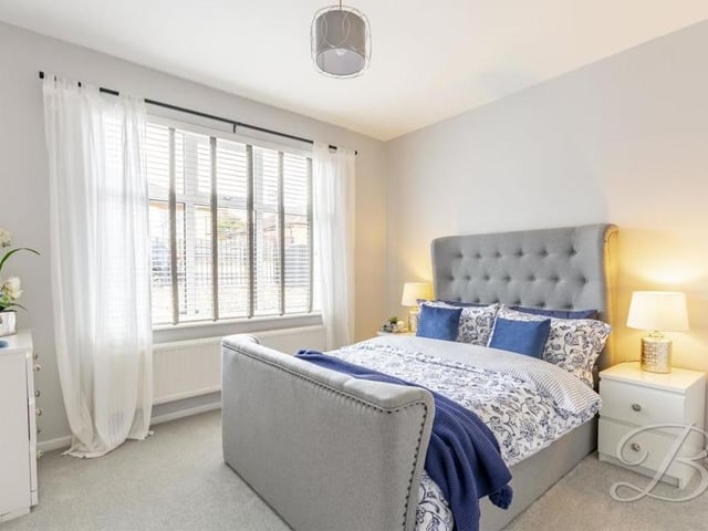 The two bedrooms have been kept to an excellent standard, particularly this first one. It is a delightful space, with its carpeted floor and a large window overlooking the front of the bungalow.