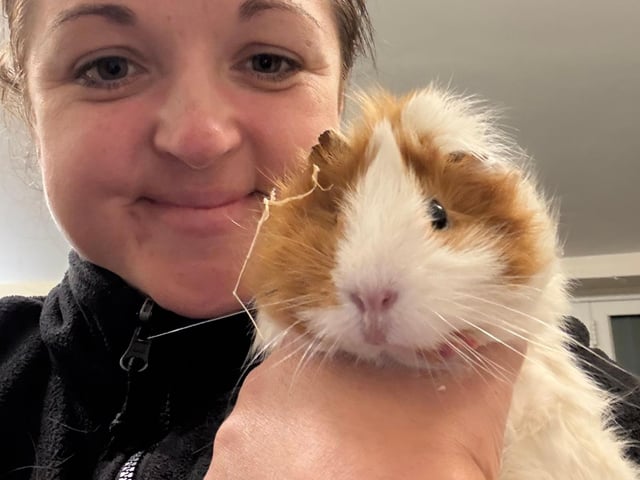 Maria with one of the guinea pigs rescued